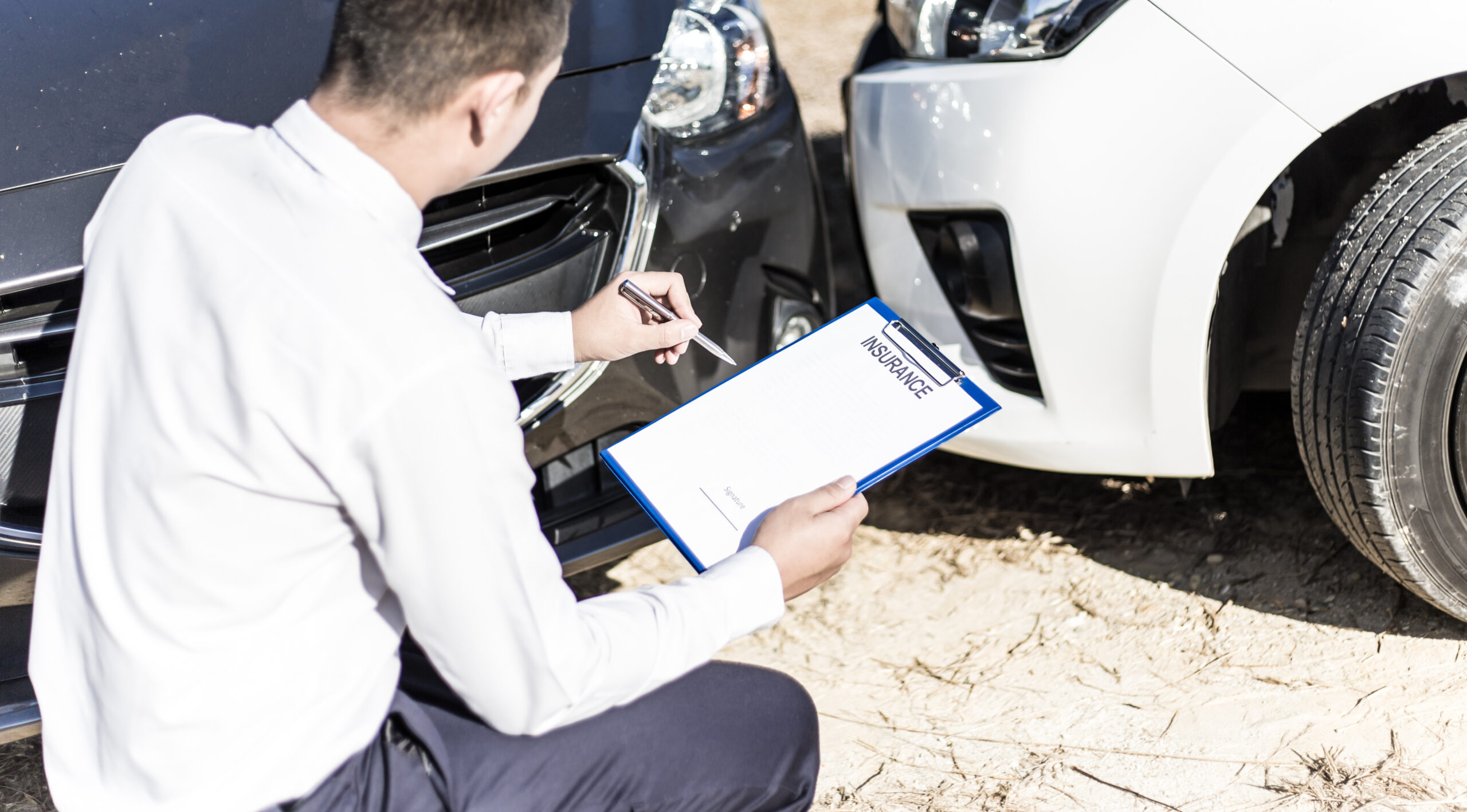 Insurance agents inspect for damage to cars that collide on the road to claim compensation from driving accidents, Insurance concept.